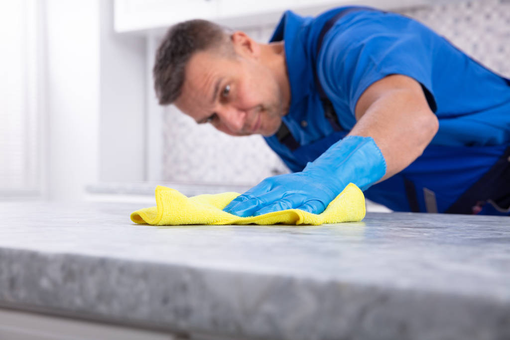 Stock Photo Mid Section Male Janitor Cleaning Dirty Kitchen Counter Spray Bottle 1